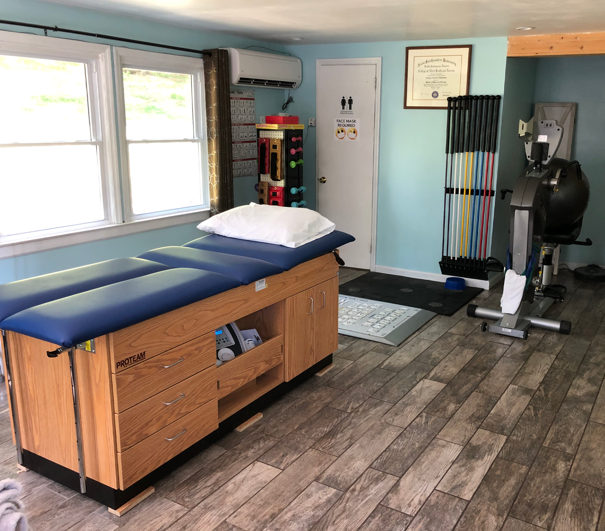 The physical therapy studio showing an bike and equipment